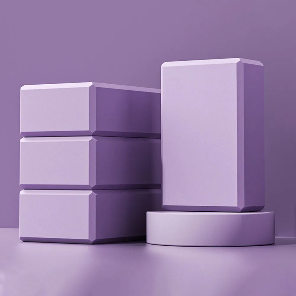Solid colour EVA foam yoga block measuring 23x15x7.6cm with textured ridges for grip