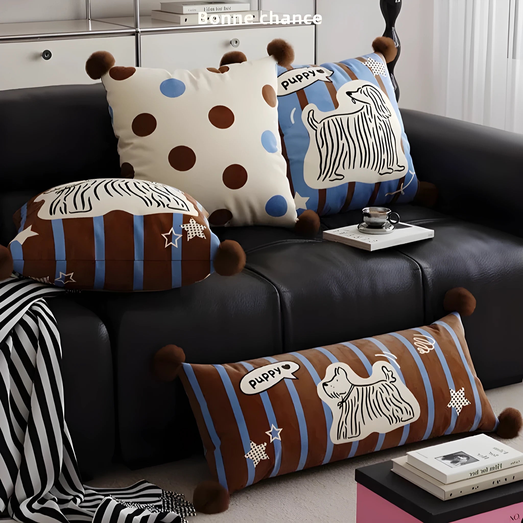 Blue cartoon animal print sofa cushion pillow on a grey sofa.