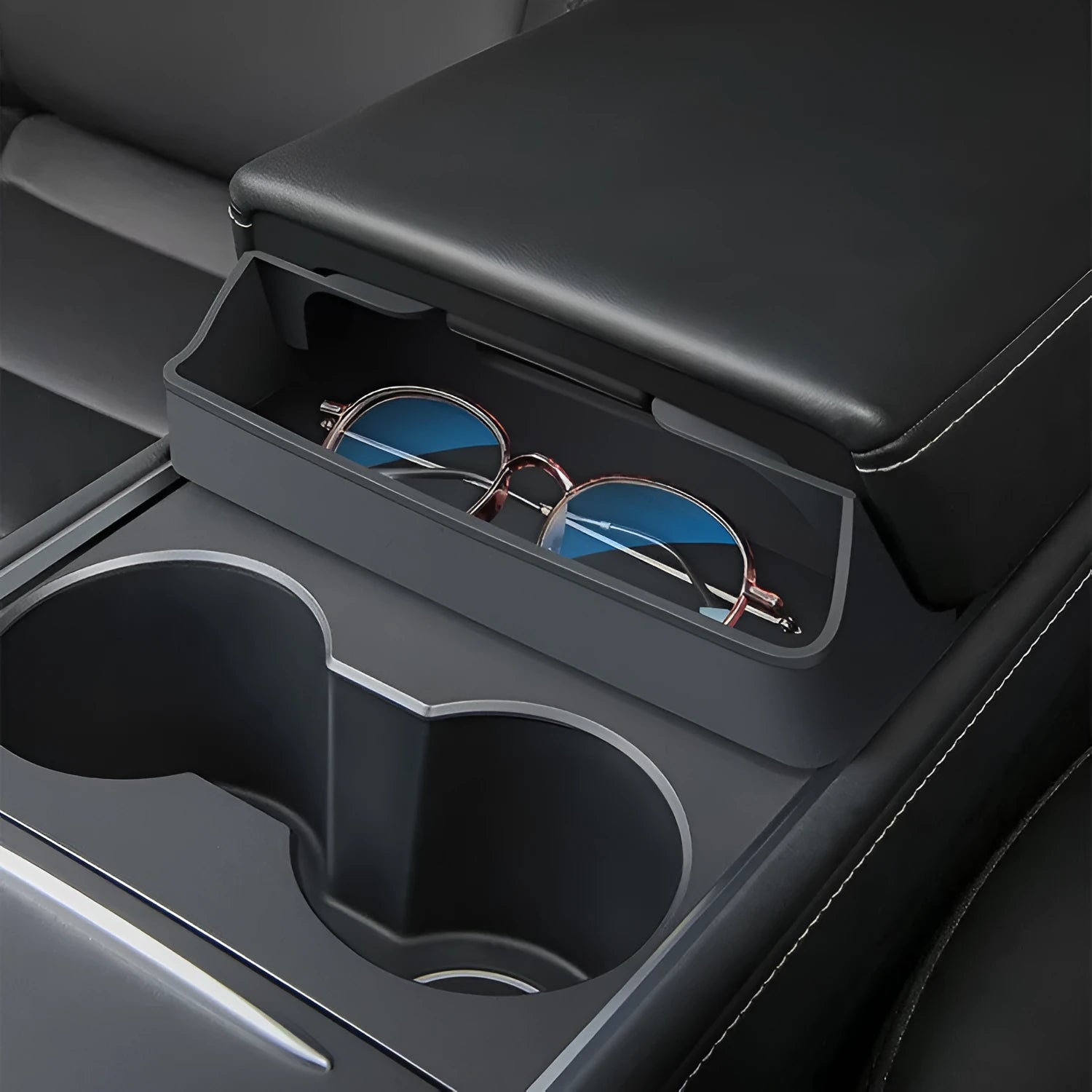 Black silicone glasses case mounted on Tesla Model 3 centre console