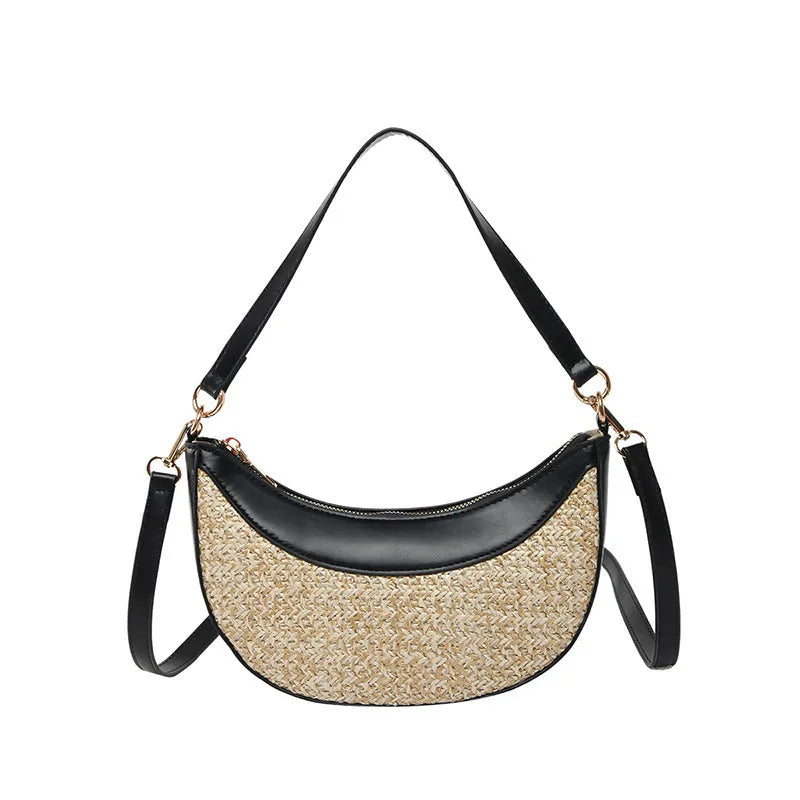 Hard woven straw dumpling-shaped crossbody bag in green with contrast stitching and a single shoulder strap.