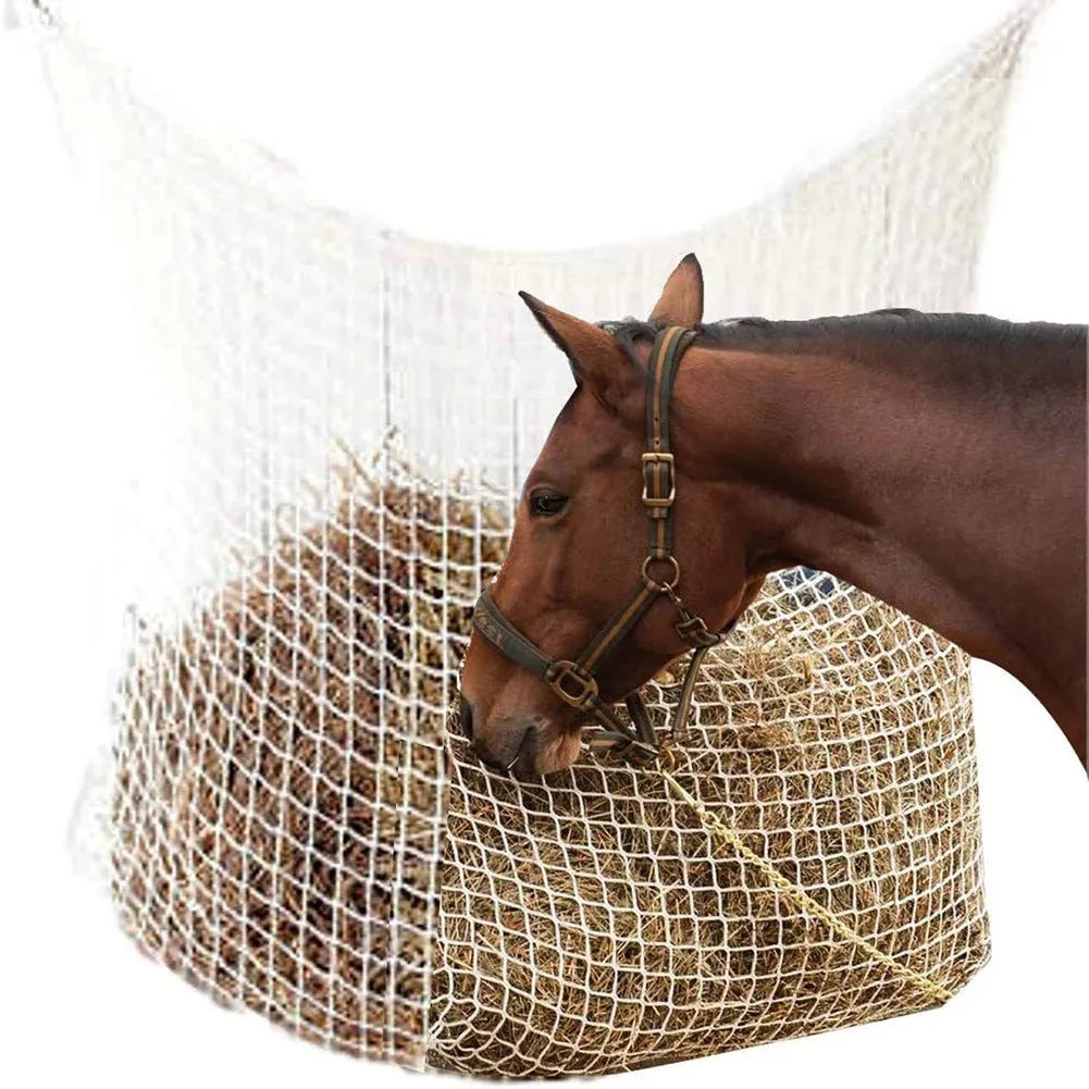 Woven PE rope mesh horse feeding bag hanging with hay inside, black colour shown