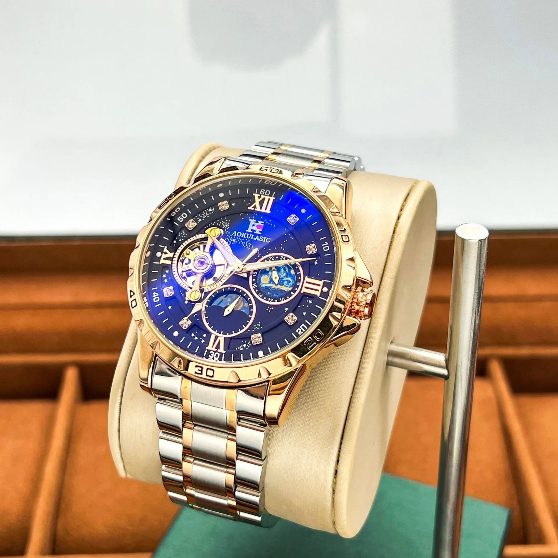 Men's automatic mechanical watch with rose gold case and black dial showing 12mm thickness