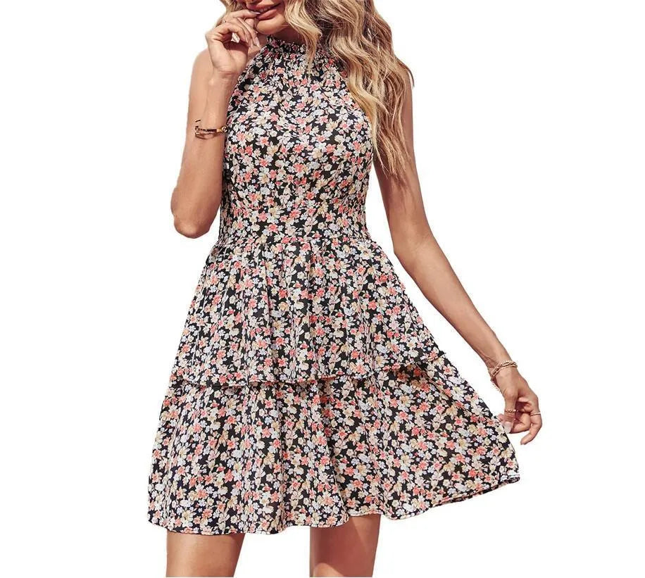 Women's boho-style backless halter dress with ruffled A-line skirt in a printed pattern.