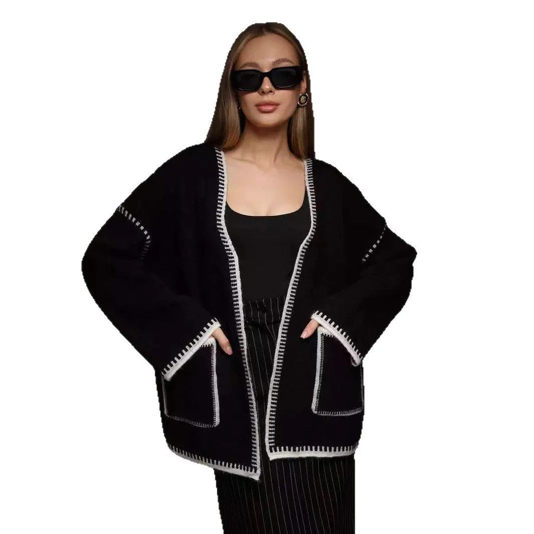 Lace-up front knitted cardigan in camel colour showing loose mid-length design and long sleeves