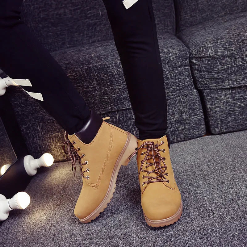 Men's pink Martin ankle boots with velvet lining, round toe, flat sole, and front lace-up closure.
