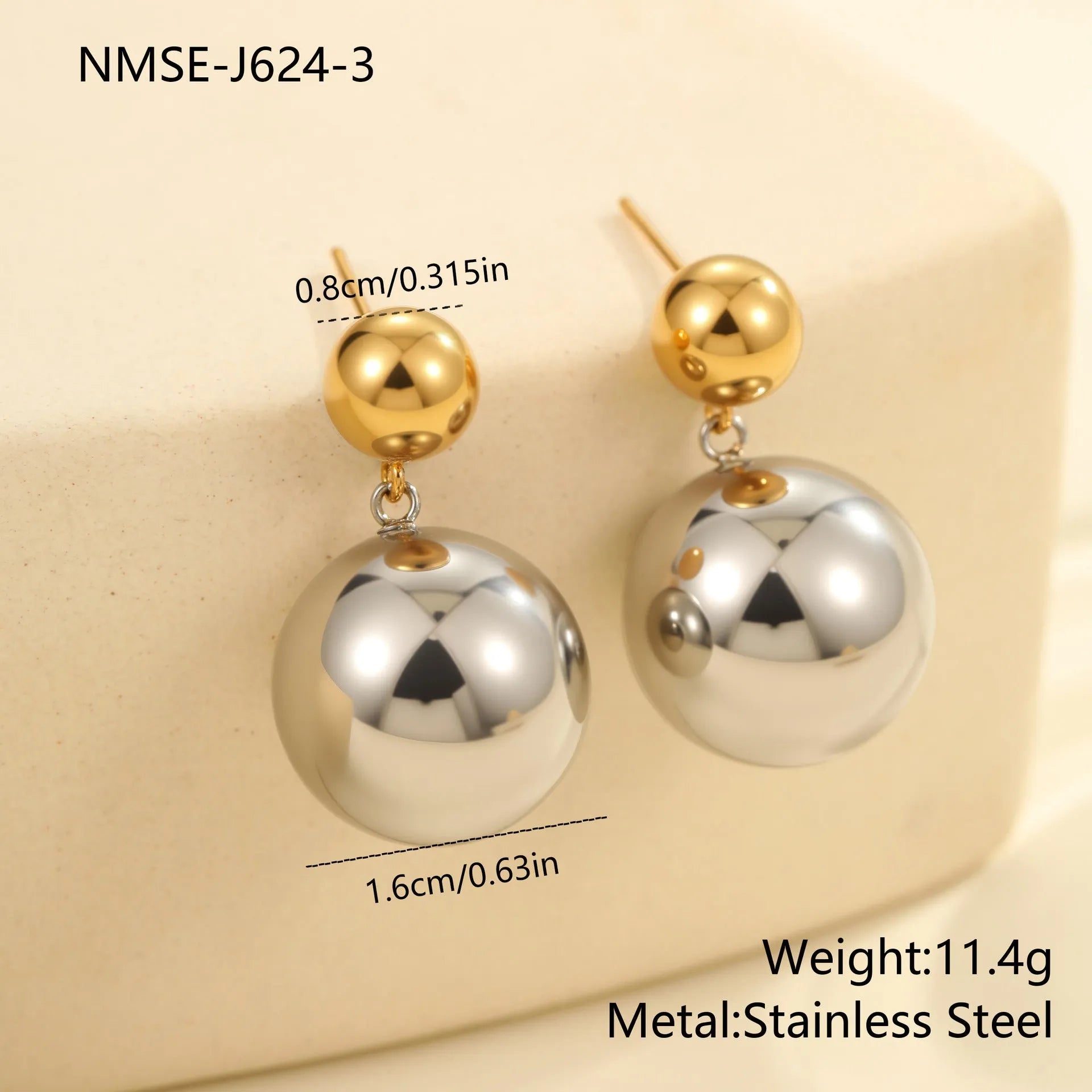 A pair of round bead stainless steel stud earrings with a colour-block geometric design.