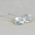 Glossy silver round women's earrings with retro bird and flower design