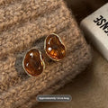 Handmade alloy holiday earrings set showing three geometric styles with tassel detailing