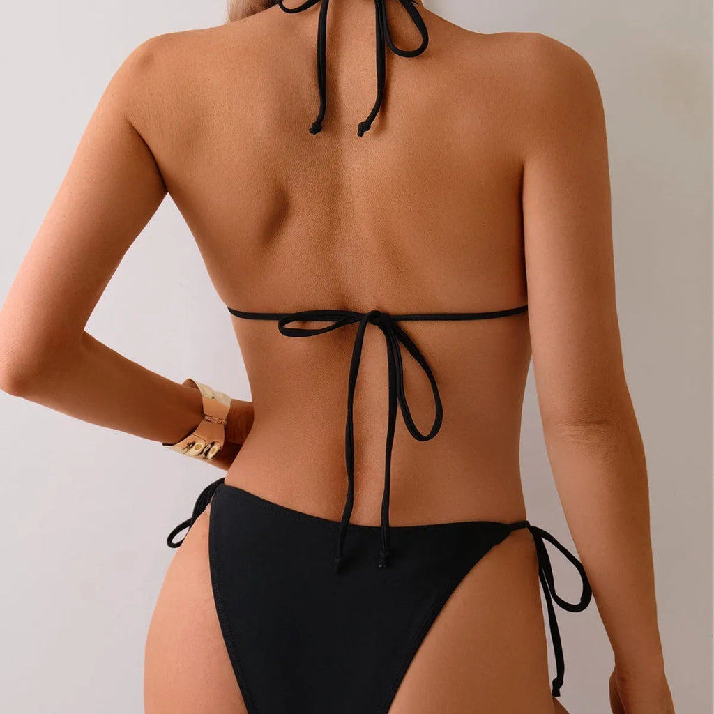 Black women's bikini swimsuit with metal bead decorative details on two-piece set