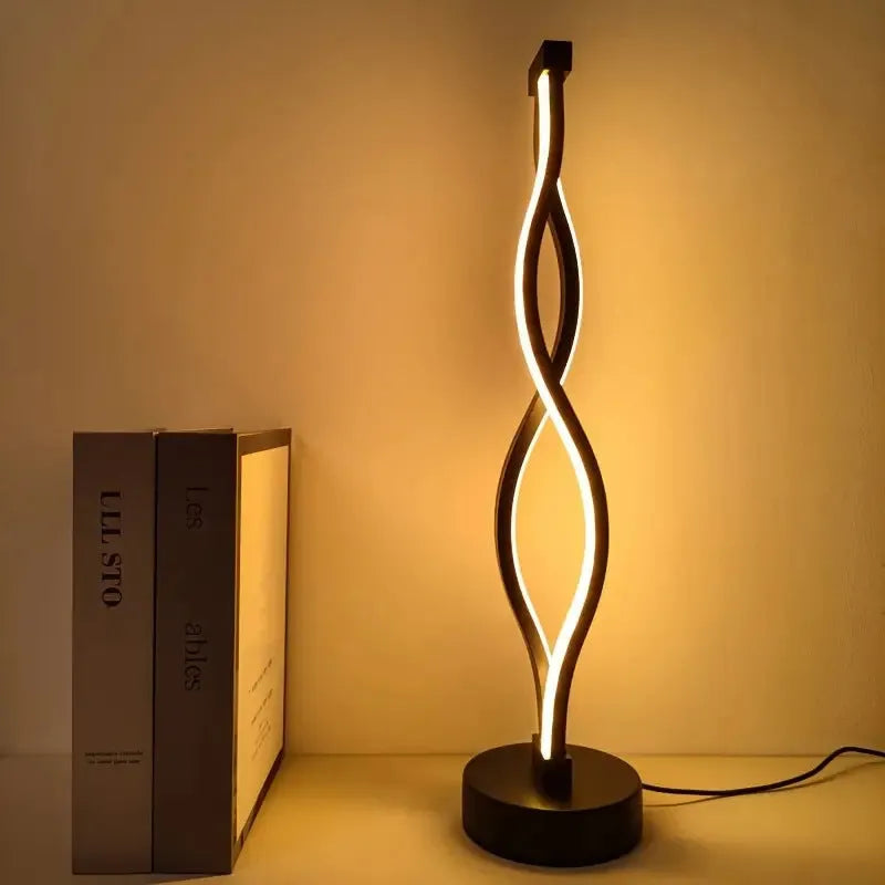 Black aluminium desk lamp with touch dimming buttons in blue and pink, showing three colour temperature modes