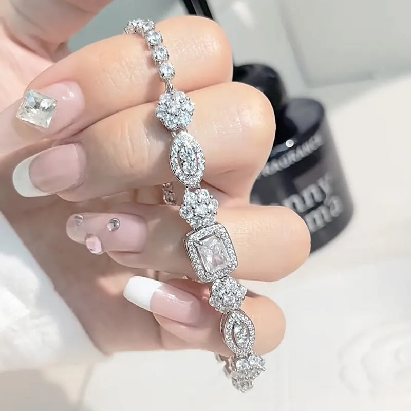 Women's geometric bracelet with silver and white gold plating and sparkling inlaid zircon stones.