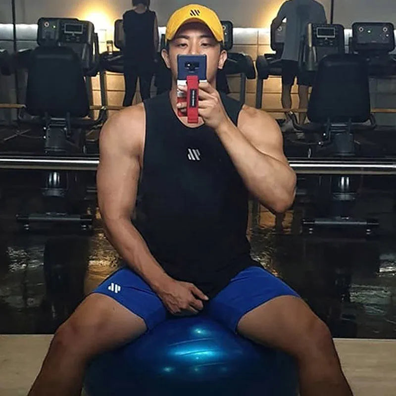 Loose fit metal silk fabric sports shorts in army green colour for summer running.
