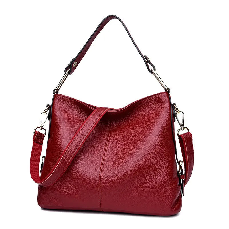 Genuine leather vertical square crossbody bag showing internal zipper compartments and external sandwich pocket