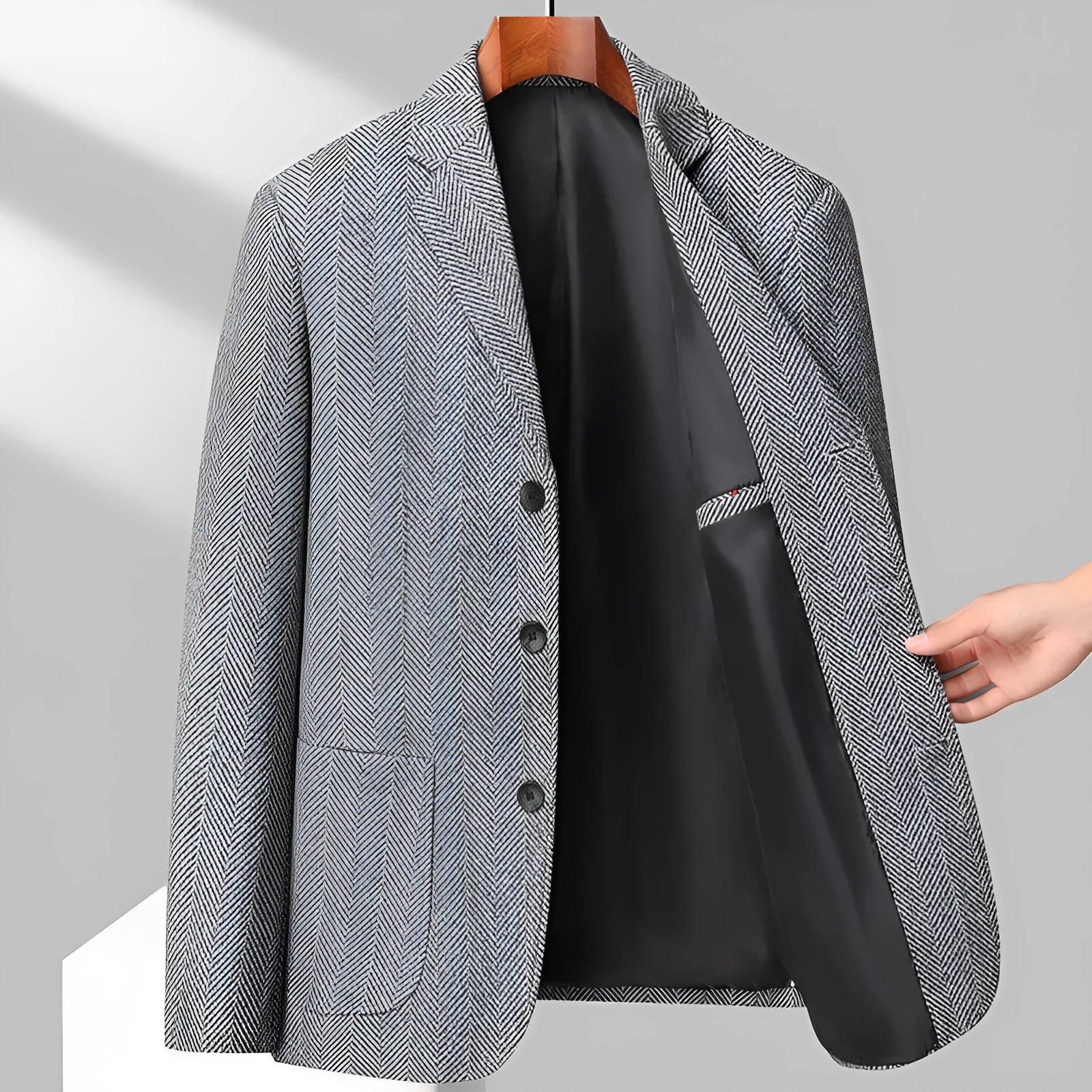 Men's loose fit woolen coat in a solid colour, shown on a model for casual spring or autumn wear.