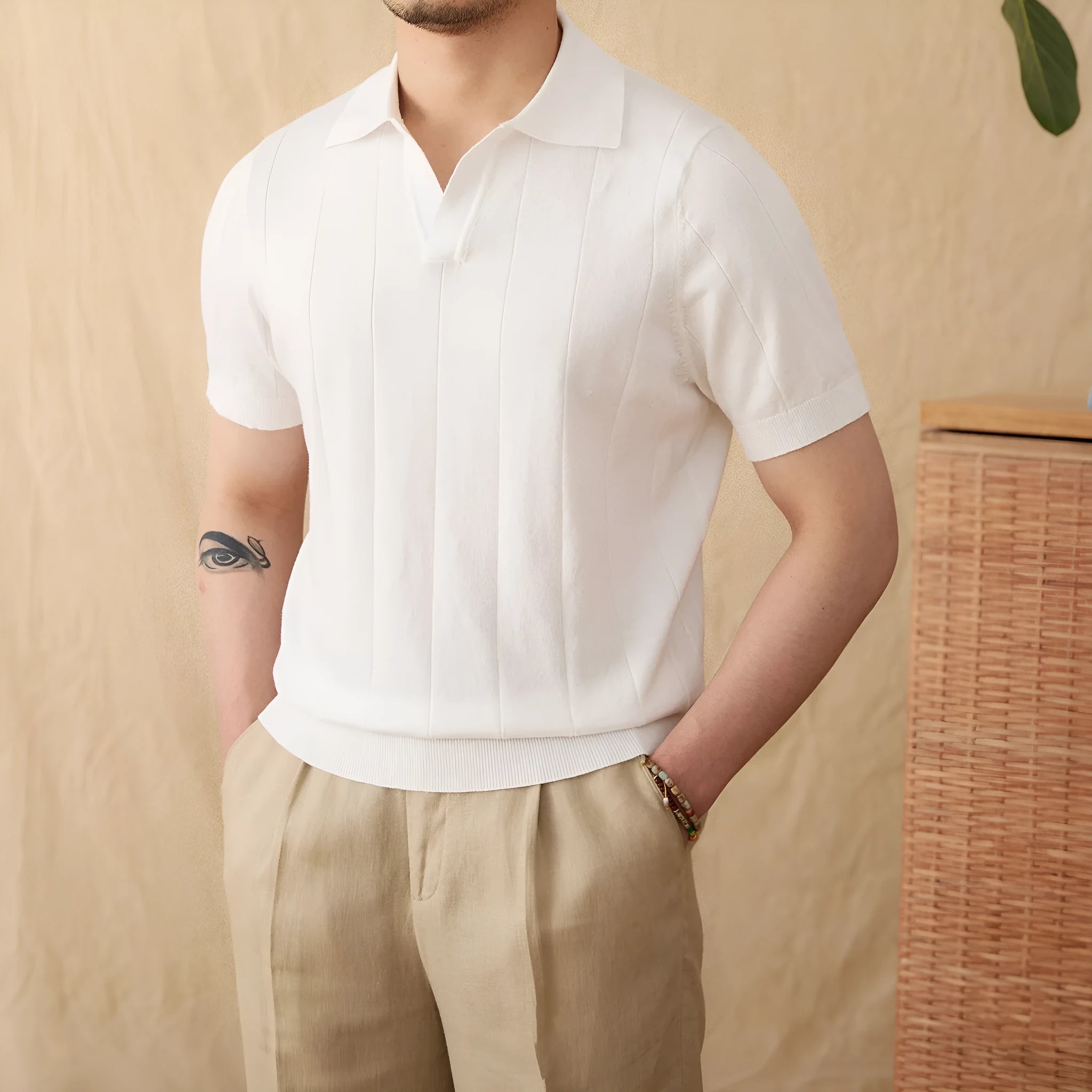 Men's purple sunken stripe knitted polo shirt with a seagull collar on a hanger.