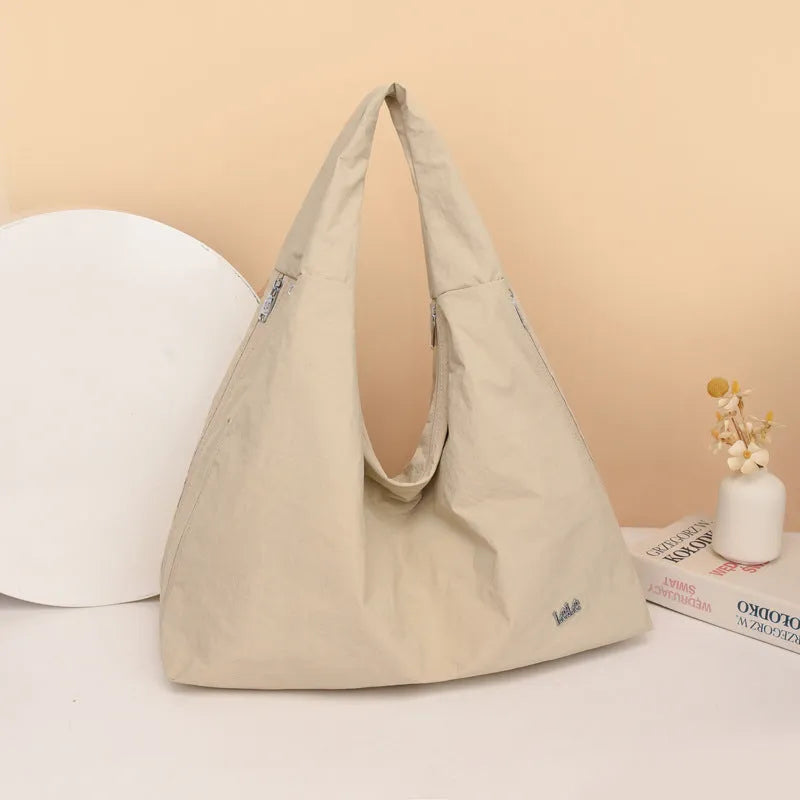 Women's heart-shaped nylon underarm bag in black, blue, khaki, and yellow colour options