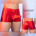 Seamless men's boxers in red nylon fabric with mid waist and elephant nose pouch design.