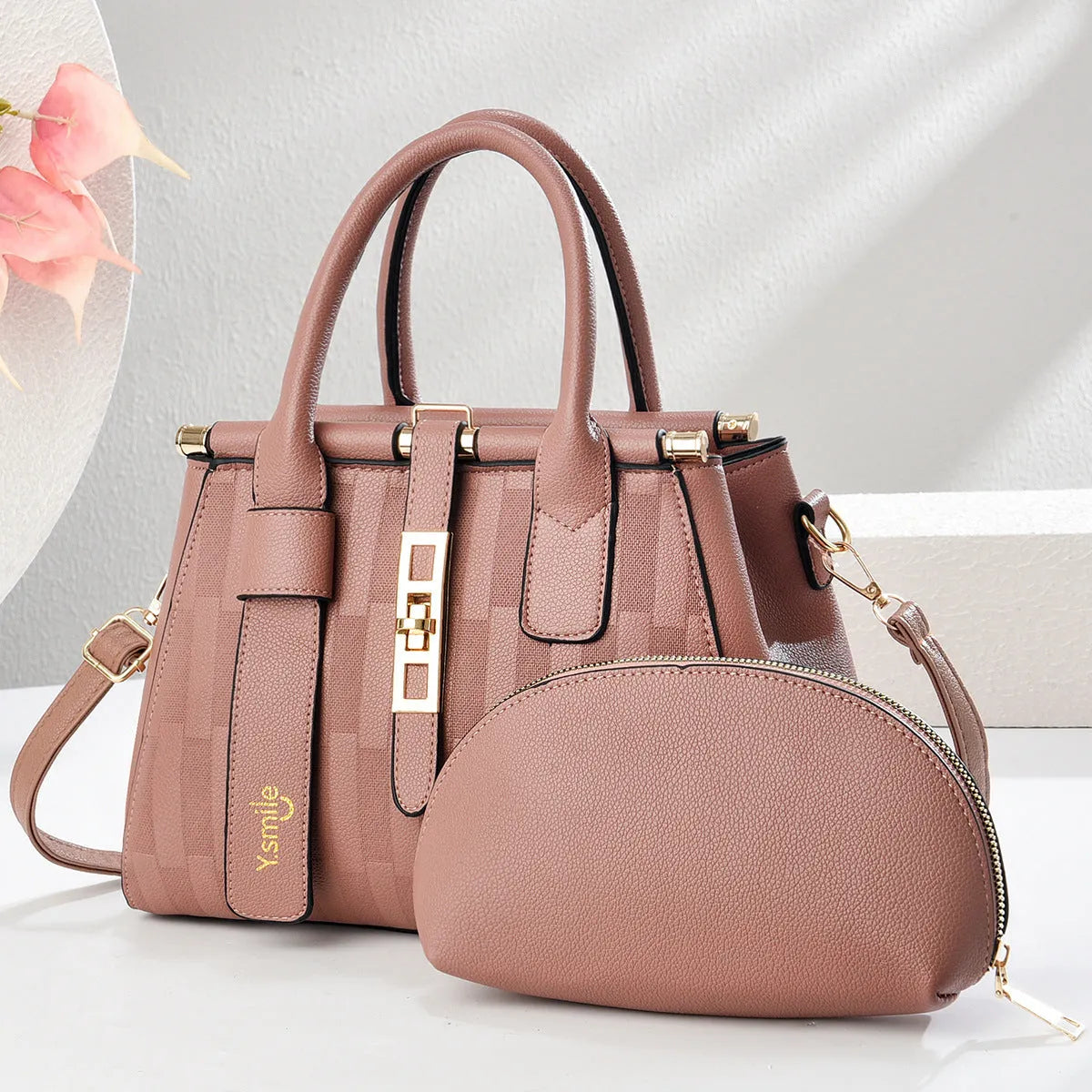 Round black PU leather crossbody bag with adjustable strap on a mannequin, showing zip closure.