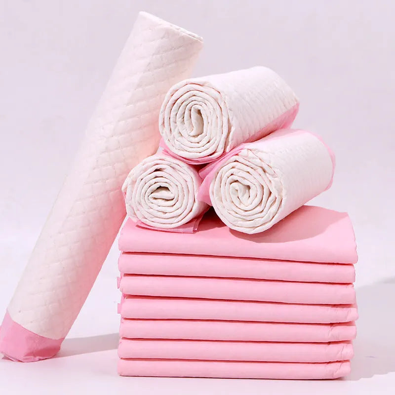 Pack of disposable pet urinal pads showing bamboo charcoal and standard models in S, M, L, XL sizes