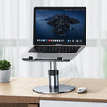 Silver aluminium car laptop stand shown at an adjusted height with a laptop secured on top.