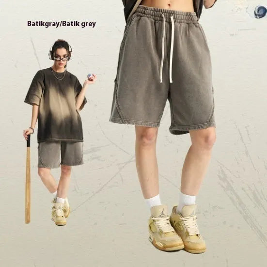 Men's loose-fit pure cotton terry shorts in a batik grey colour, showing street fashion style.