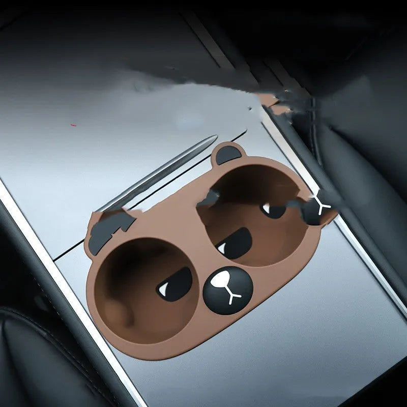 Silicone anti-shake cup holder limiter insert for car centre console in grey, tan, and pink colour options.