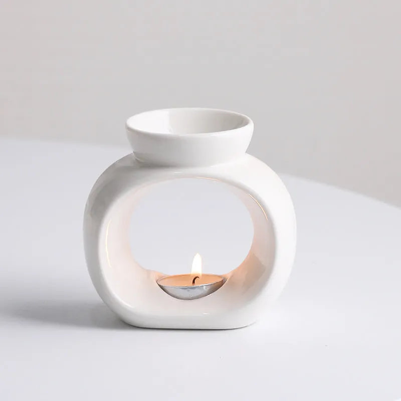 White ceramic Nordic style aromatherapy stove ornament measuring 10cm diameter