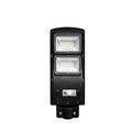 Integrated solar-powered street light with LED panel and remote control for outdoor use.