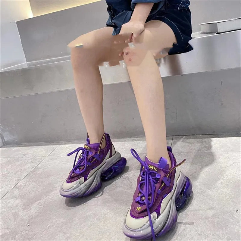 Women's green leather sports shoes with thick soles and cross-tie lacing on a white background.