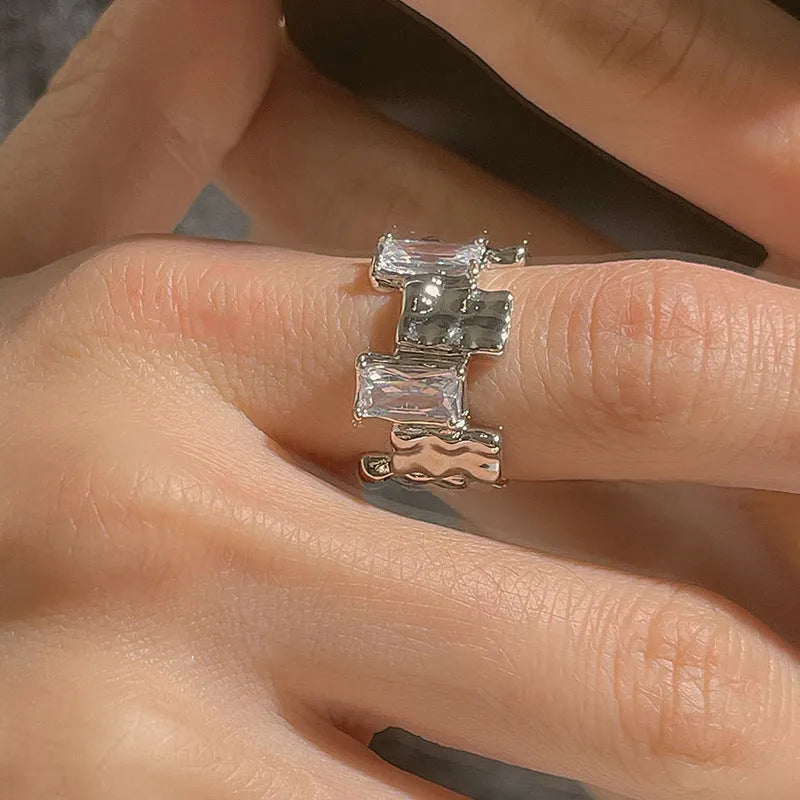 Silver cross zircon ring with open geometric design and three-dimensional decoration