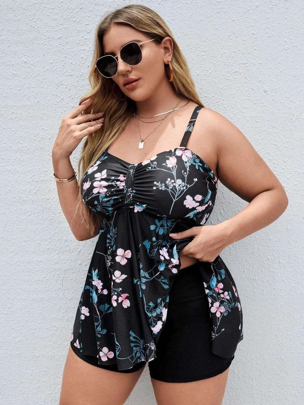 Women's plus size floral print one-piece swimsuit in split colour design.