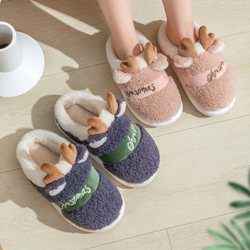 Pair of Christmas elk winter home slippers with suede upper, available in candy colours