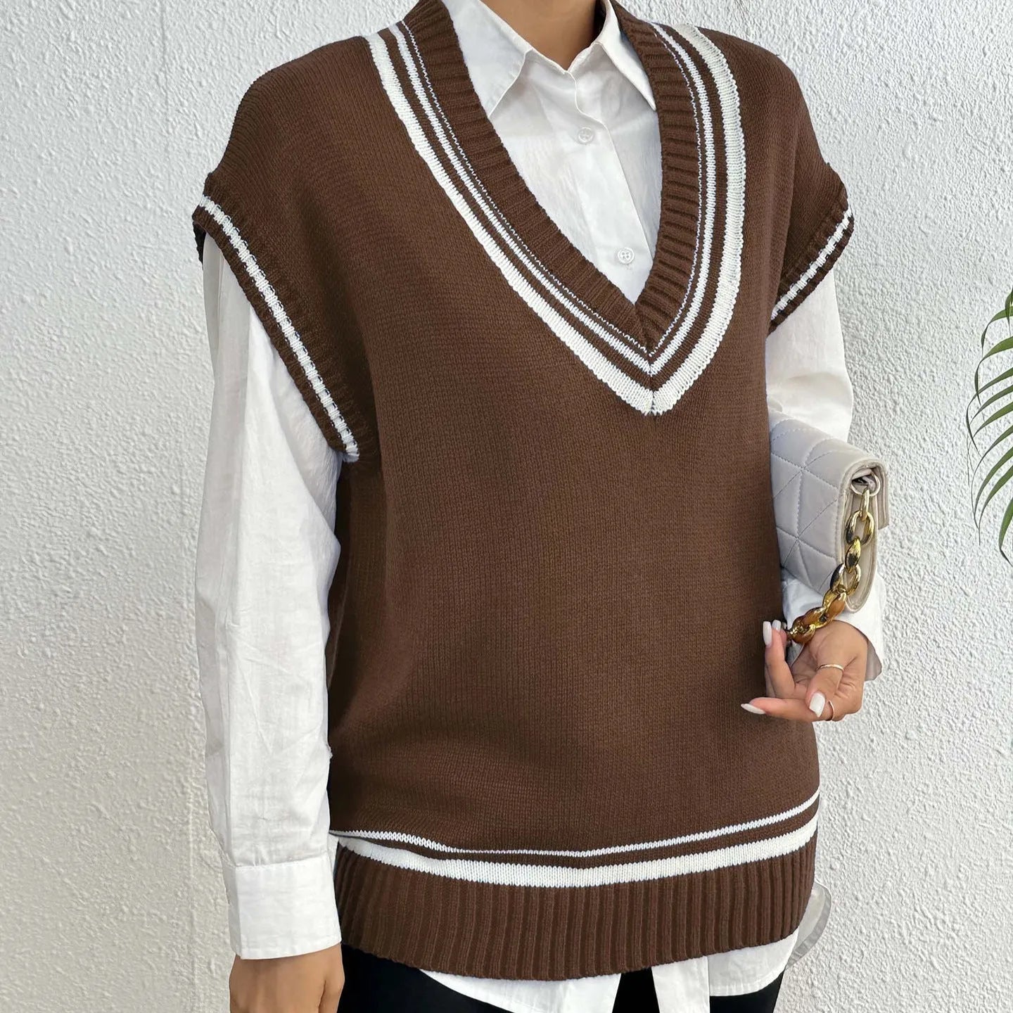 Women's loose fit college style vest sweater in blue, coffee, or black colour.