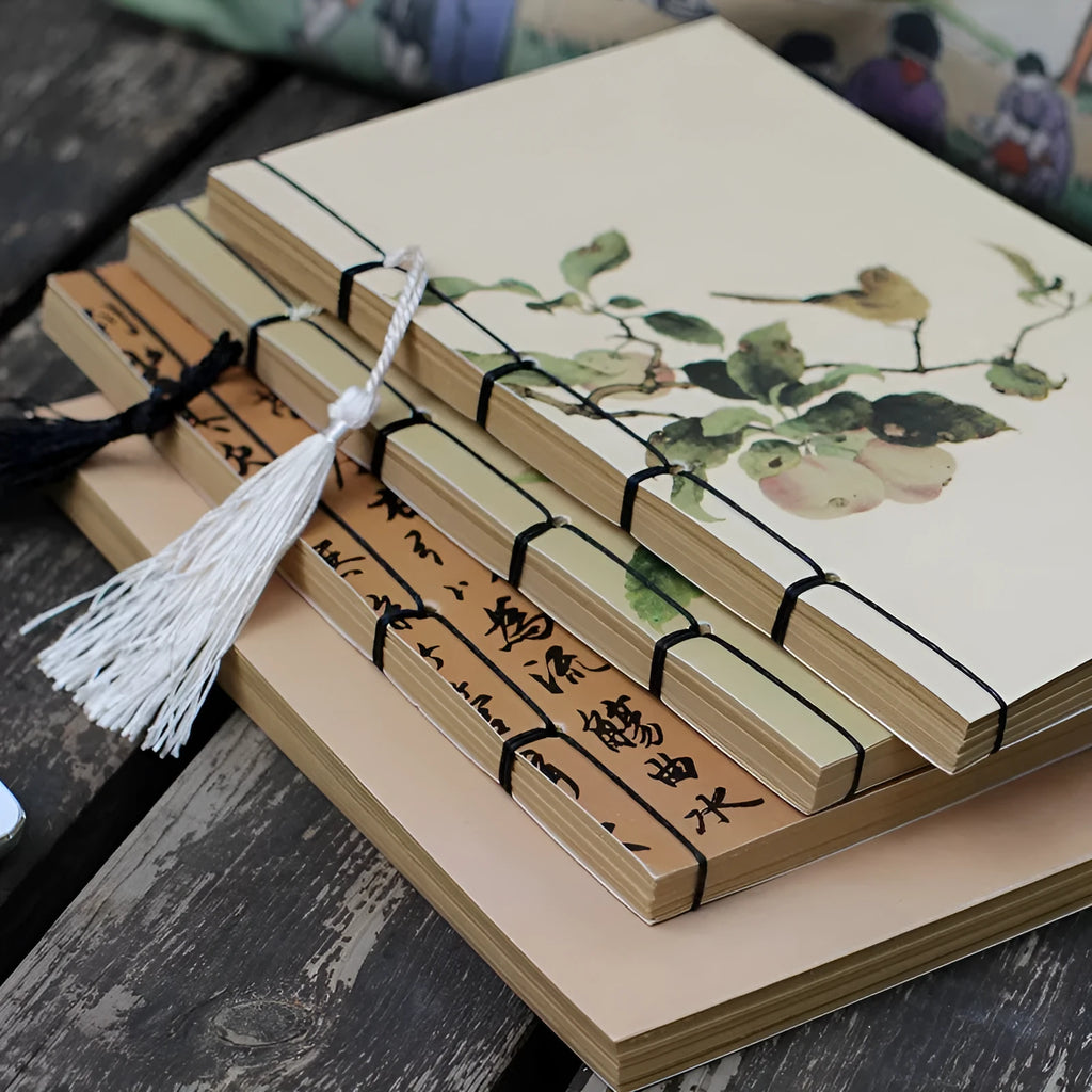 A5 antique wire-bound notebook with retro painting cover, open to show Kraft paper pages