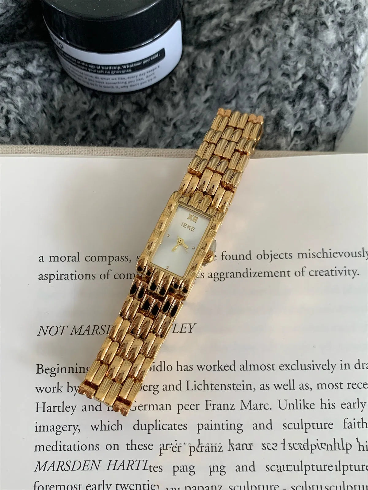 Women's bracelet-style watch with 15mm dial, mineral glass, and butterfly buckle in silver or gold finishes