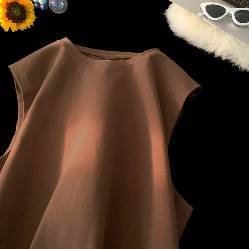 Men's loose solid colour cotton tank top sleeveless t-shirt on a hanger.