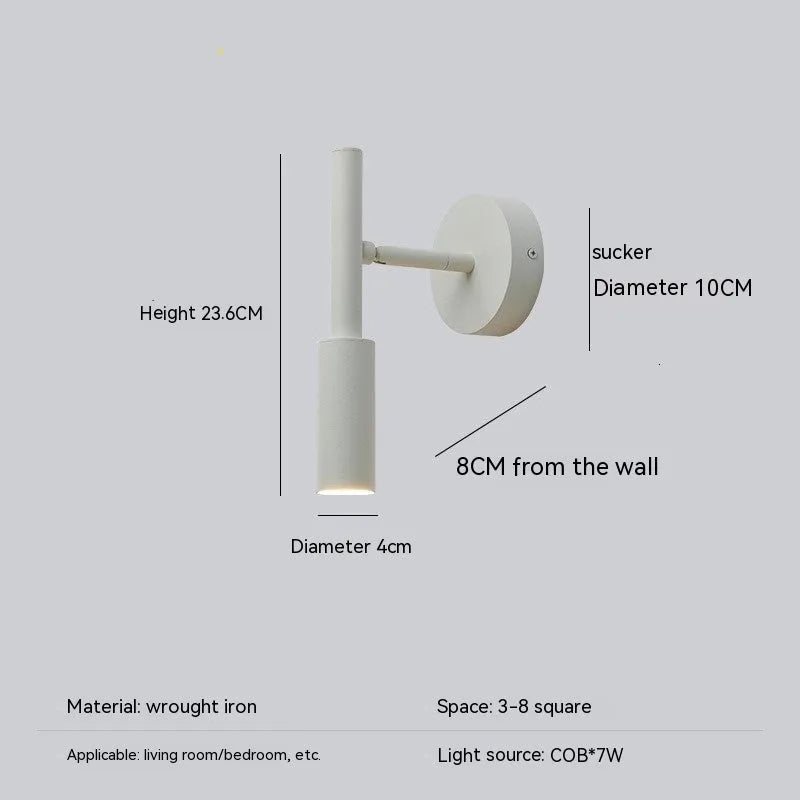 Modern wrought iron wall lamp in black or white, 100mm by 230mm, with three colour light options.