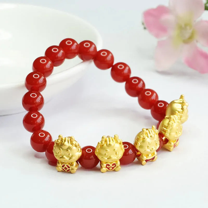 Close-up of 8mm red agate bracelet with carved Five Blessings Dragon design on wrist.