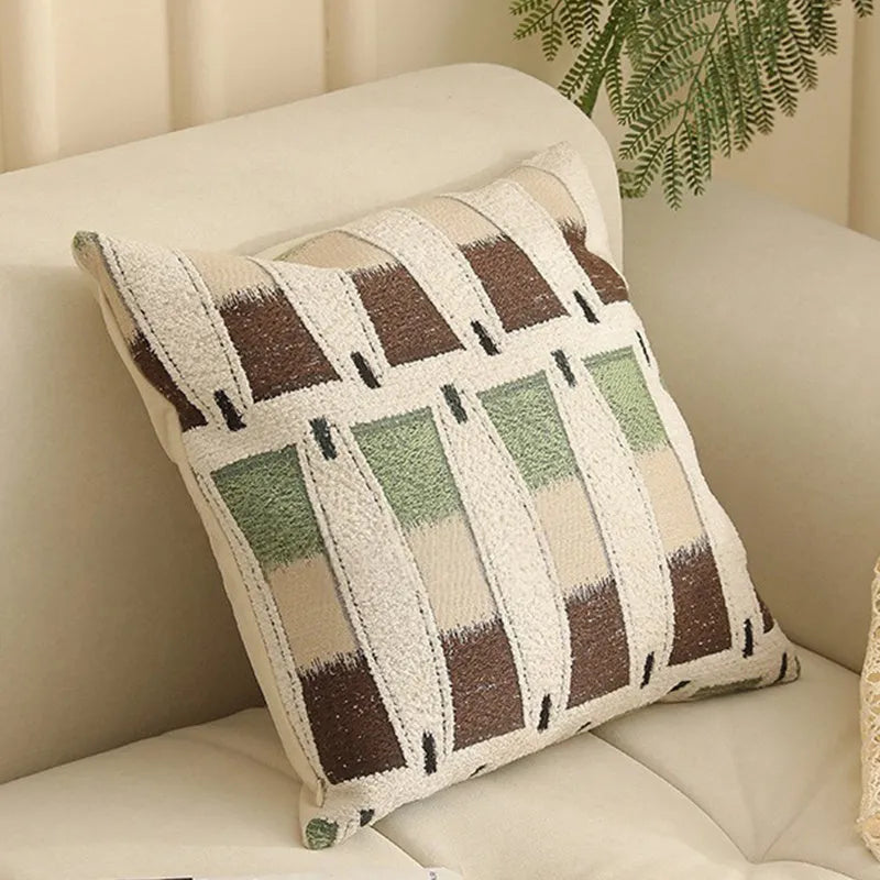 Jacquard floral pattern cushion cover in a retro colour, 45cm square, on a sofa.