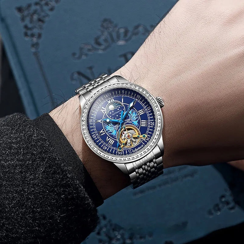 Men's stainless steel mechanical watch with transparent case back showing movement and butterfly buckle