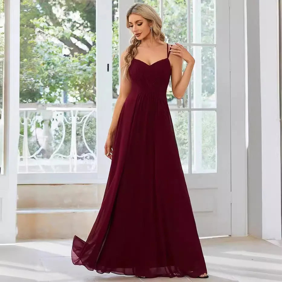 Women's sleeveless long A-line pleated dress in solid colour polyester fabric