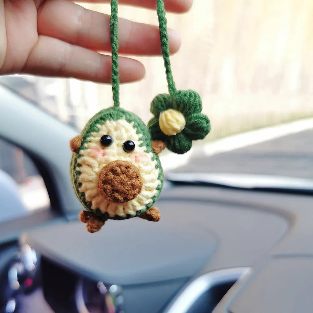 Handmade crocheted avocado car pendant with rainbow flower design in wool material