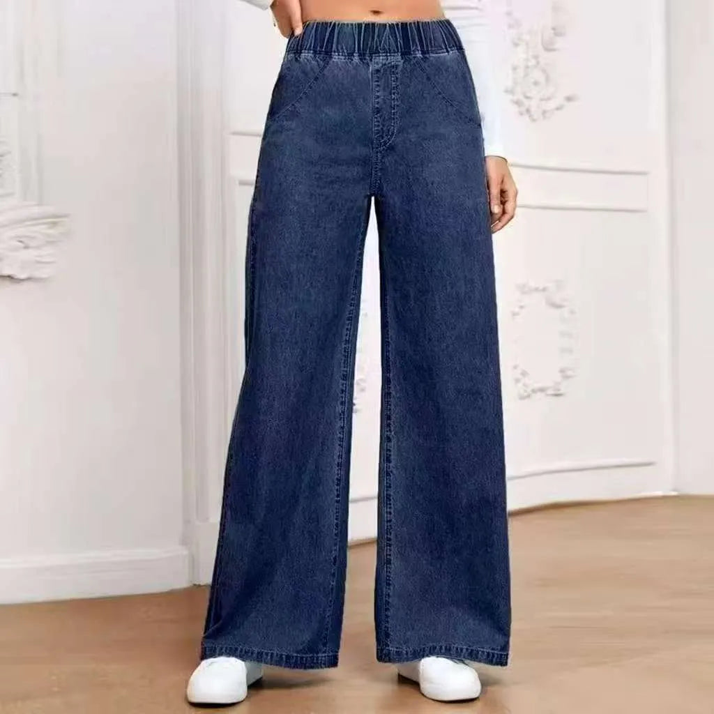Light blue washed denim trousers with wide-leg straight cut and mid waist design