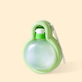 Green dog travel water bottle with integrated drinking bowl for outdoor use