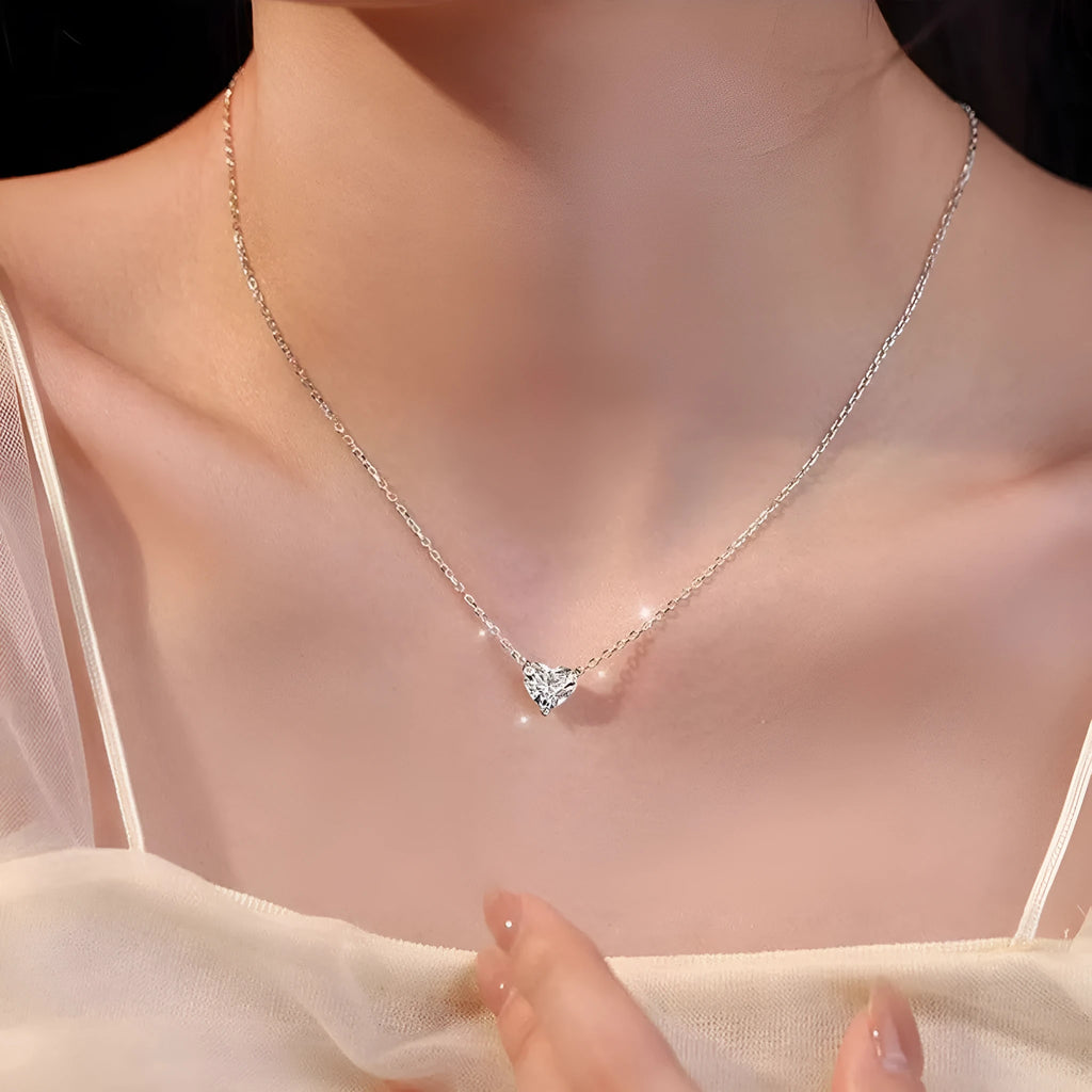 Silver-coloured copper heart pendant necklace on a chain, simple refined graceful design