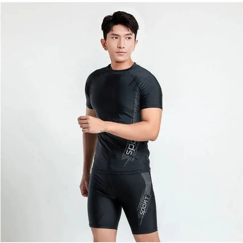 Men's plus size polyester swimsuit set showing top and trousers on a hanger
