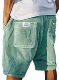 Men's grey corduroy shorts with embroidered detail on multiple pockets, laid flat.