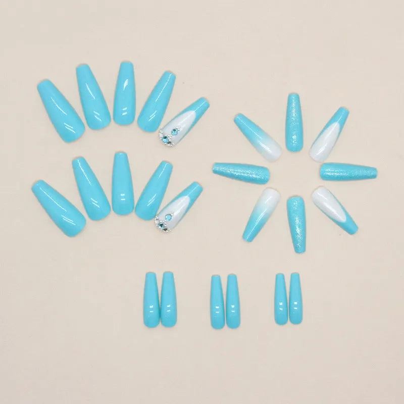 Smart blue diamond press-on nails with long ballet shape and debris pattern