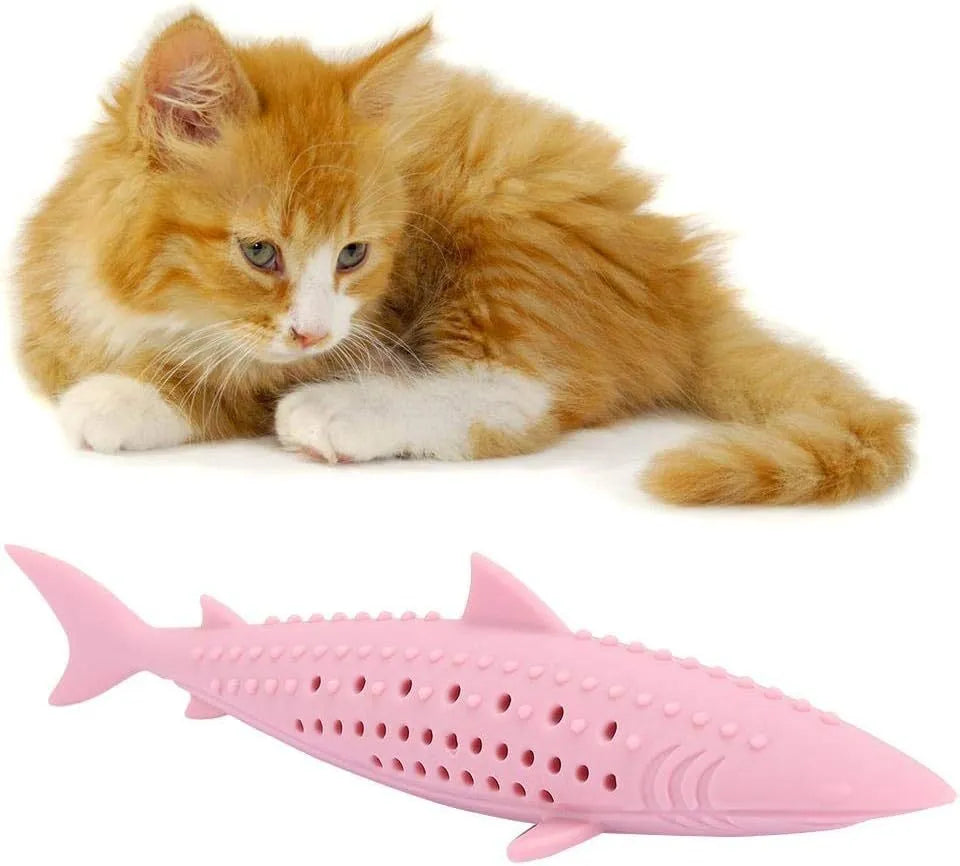 Green silicone fish shaped cat chew toy with breathable side holes on a white background