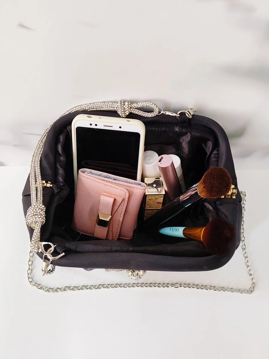 Women's soft polyester crossbody bag in shell shape with chain decoration and internal document organiser